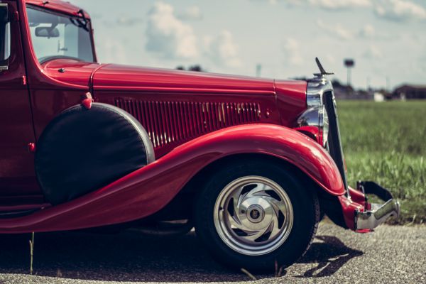 A side view image of the front of an antique car