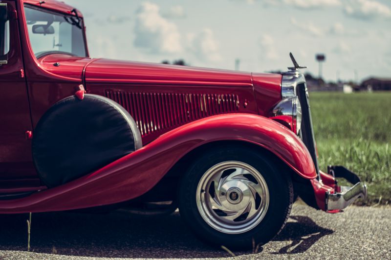 A side view image of the front of an antique car