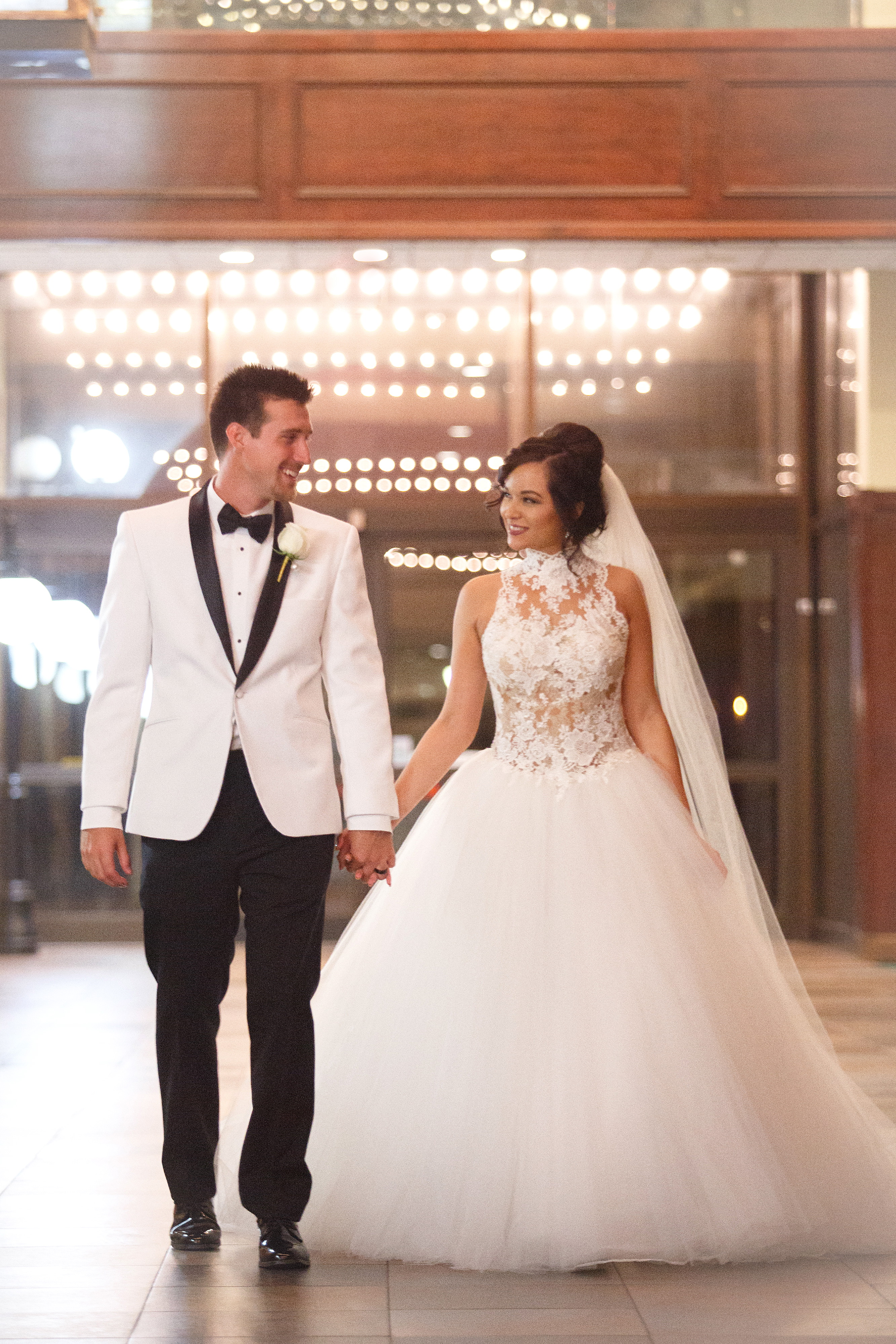Groom and Bride holding hands 