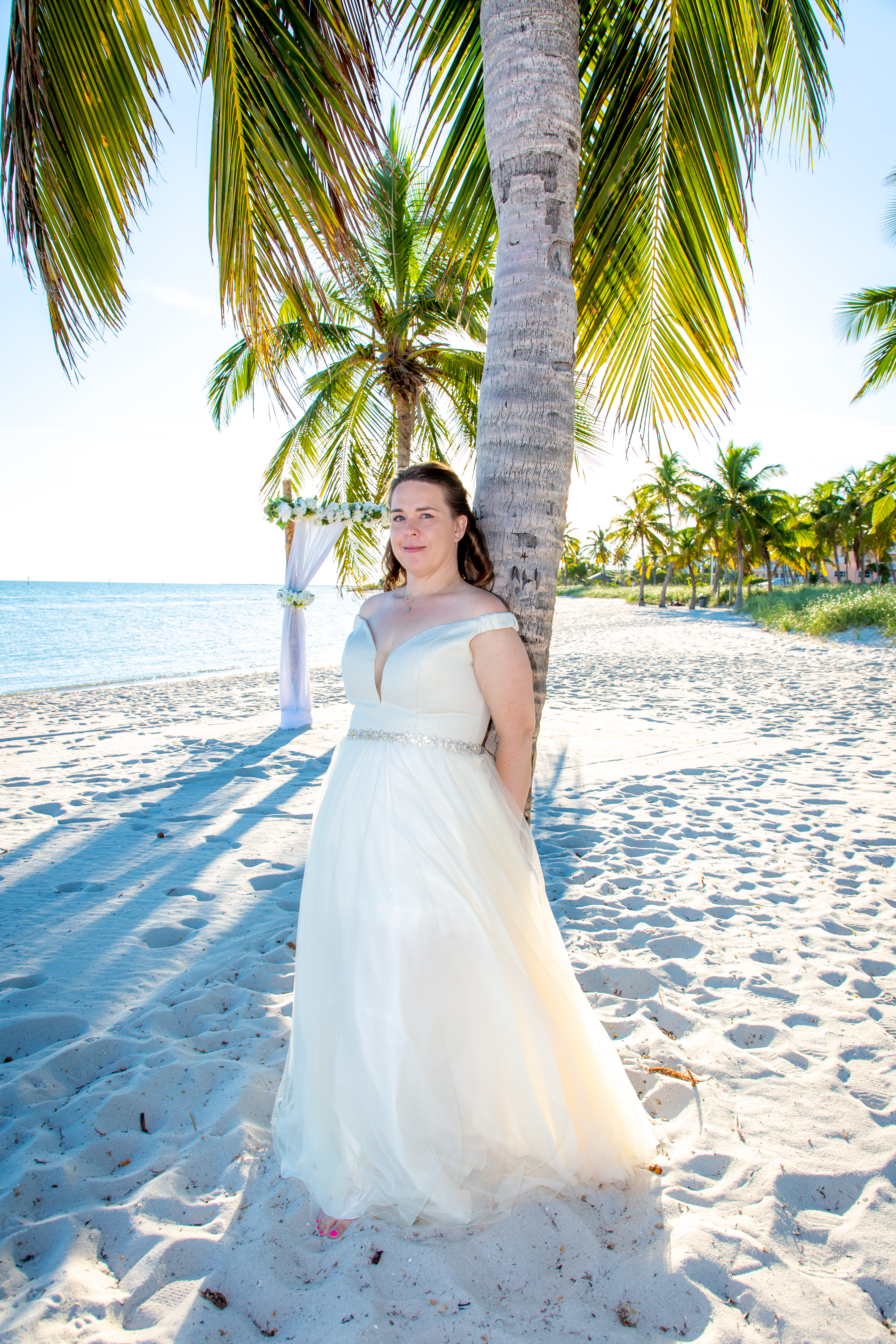 Wedding couple on Smathers Beach in Key West, Florida after their elopement by Southernmost Weddings