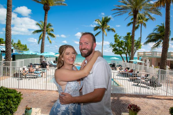 Bride walks through a tropical garden to start her wedding by Southernmost Weddings