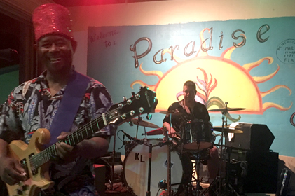 closeup of musicians playing on outdoor stage